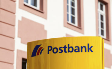 Postbank sign in Germany Weilburg, Germany - Sep 3, 2017: Yellow Postbank service sign on the historic building in Weilburg, Germany