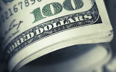 close-up-view-of-stack-of-US-dollars close-up-view-of-stack-of-US-dollars