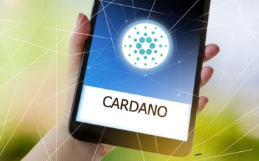 virtual money cryptocurrency on the smartphone screen in a hand - Cardano accepted here virtual money cryptocurrency on the smartphone screen in a hand - Cardano accepted here